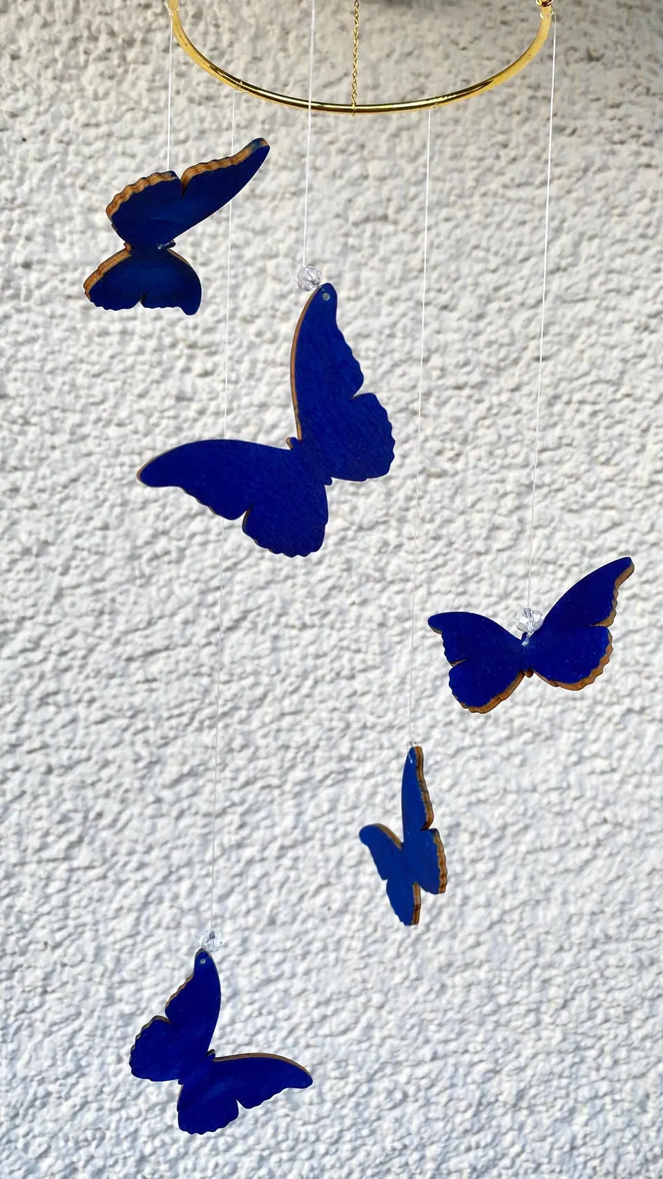 Butterfly wind chime. Wooden mobile in blue. Decoration for your home, balcony, and garden. Window decoration. Butterfly mobile. Butterflies