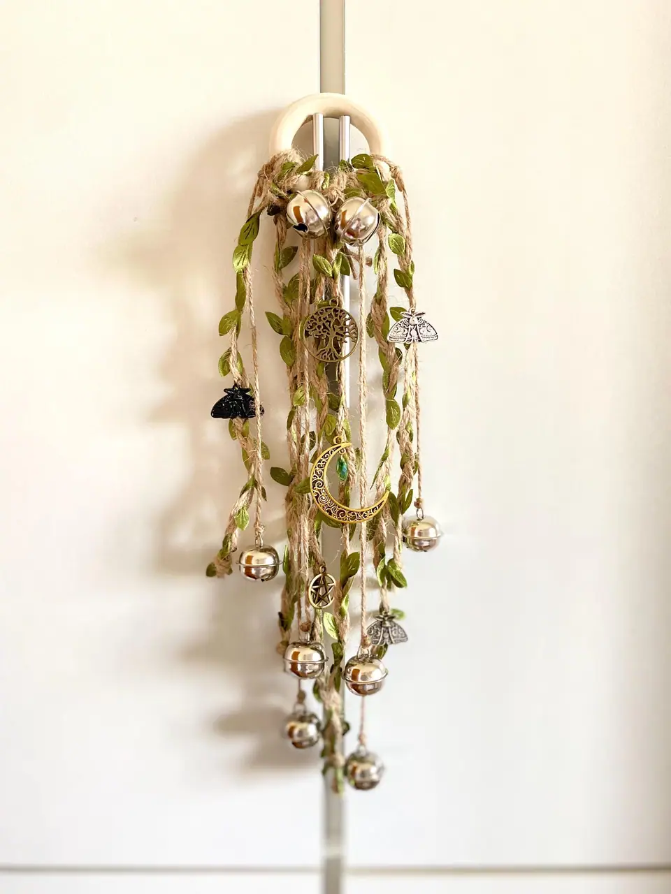 Door hangers with small bells for decoration and home protection. Door handle hangers. Silver bells. Door decorations for in- and outdoors.