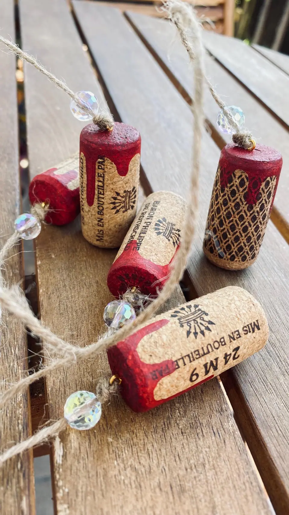 Wind chime made from wine corks for home decoration and as a gift for wine lovers. Colored corks as a decorative element. Boho style. Wine