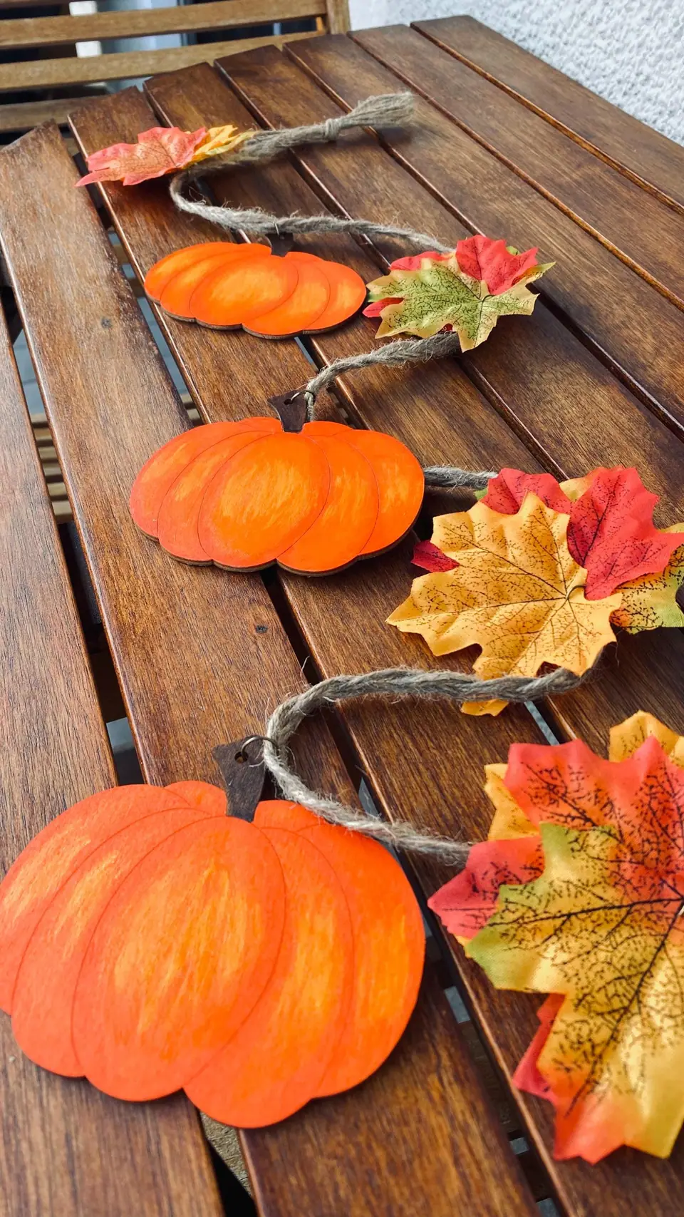 Pumpkin decorations as pendants for your home and garden. Autumn garlands for doors, walls, and windows. Autumn pumpkins. Halloween. Boho